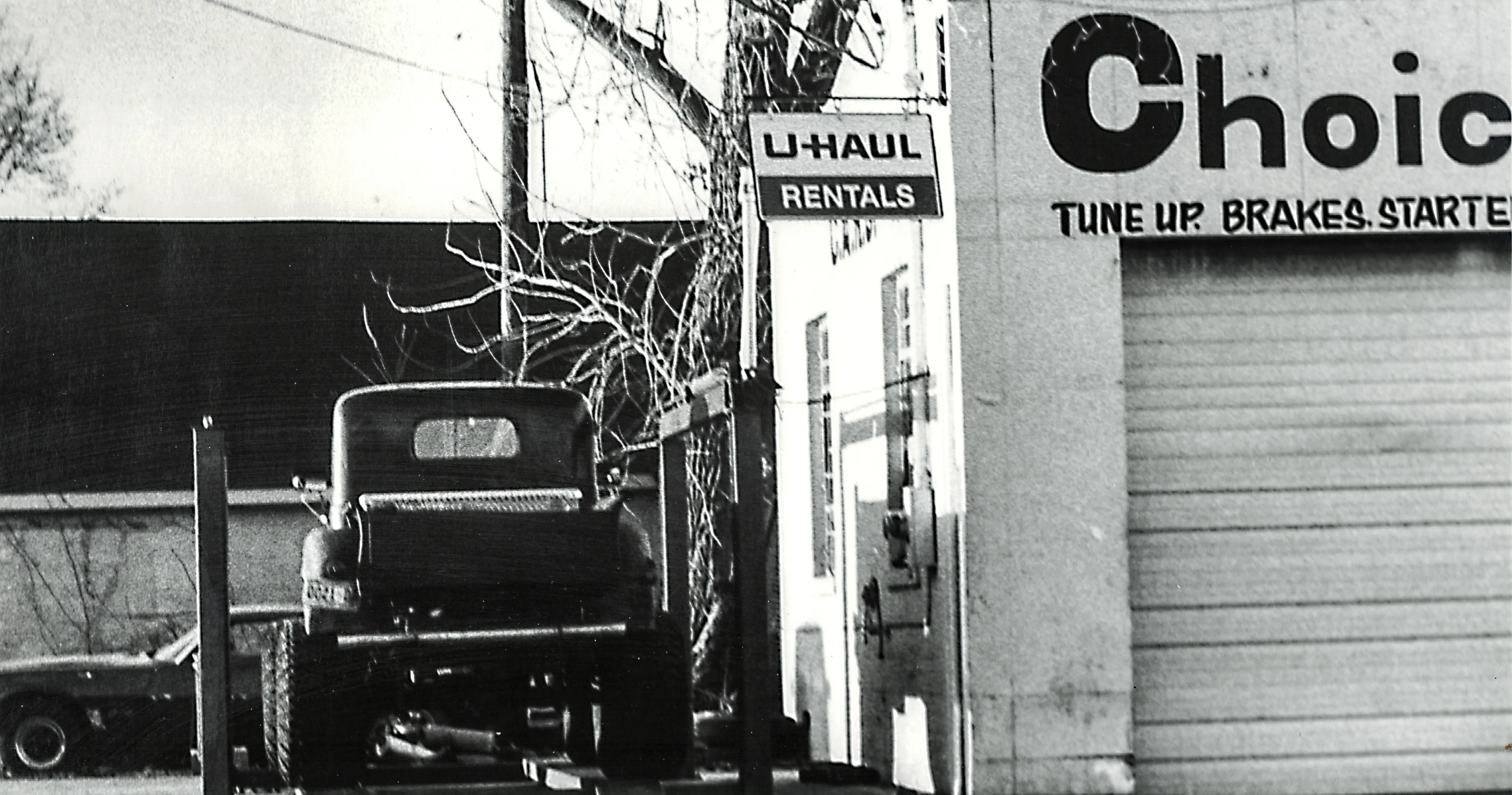 An early Nashville street photograph featuring a Choice sign and U-Haul presence within the everyday urban landscape.