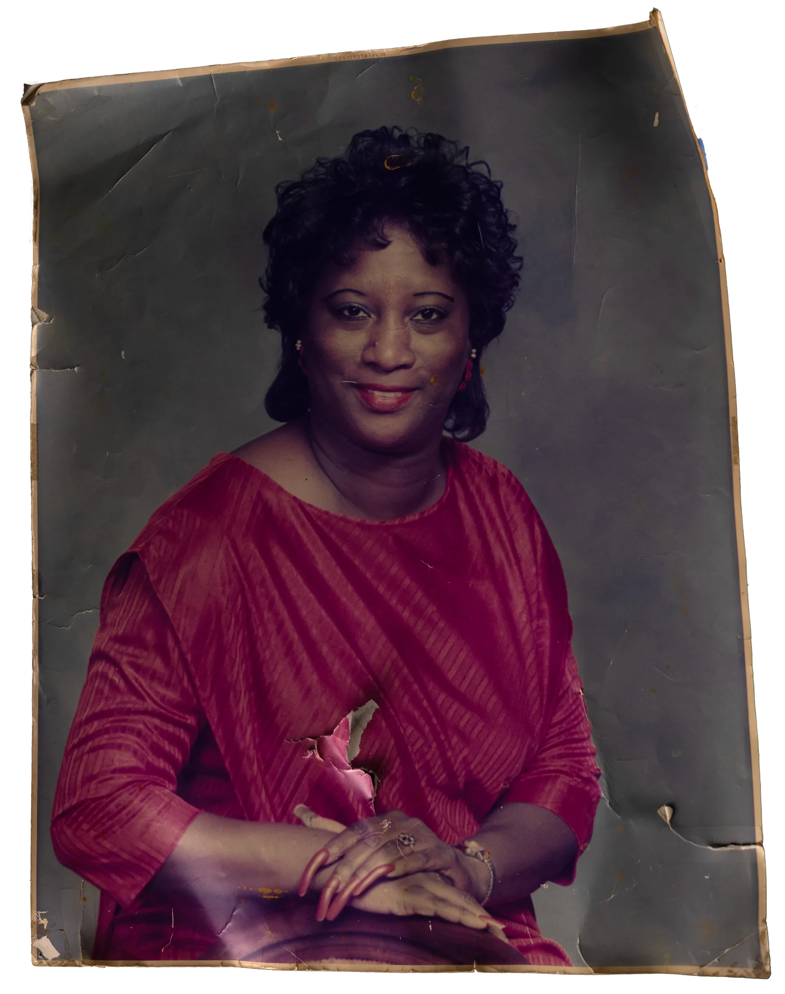 Original damaged portrait of a woman in a red dress.